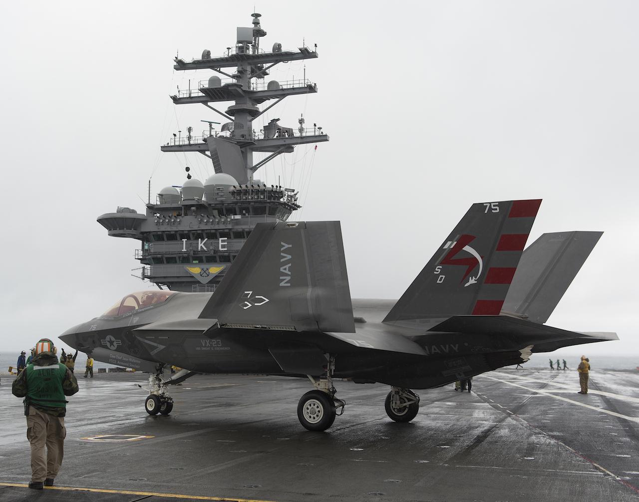 151002-O-ZZ999-002 ATLANTIC OCEAN (Oct. 2, 2015) An F-35C Lightning II carrier variant Joint Strike Fighter from the Pax River Integrated Test Force conducts its first arrested landing aboard the aircraft carrier USS Dwight D. Eisenhower (CVN 69). Two F-35Cs from the Salty Dogs of Air Test and Evaluation Squadron (VX) 23 are conducting follow-on developmental test (DT-II) sea trials aboard the Eisenhower. Cmdr. Tony “Brick” Wilson flew aircraft 73/CF-03 and Lt. Chris “TJ” Karapostoles flew aircraft 75/CF-05. (U.S. Navy photo courtesy Lockheed Martin photo by Andy Wolfe/Released)